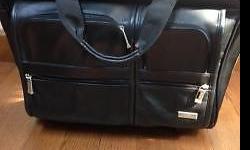 Selling this like brand-new rolling briefcase/computer bag that has barely been used (three times or less). It's made by US Luggage, and has a retractable handle that zippers away, out of sight. When fully extended, it's easy to roll and much better than