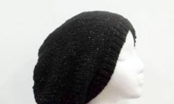 A great black beanie with lots of sparkle. This slouchy beanie hat is made with an acrylic yarn and has a colorful sparkle thread throughout. (The photos just don?t show how much sparkle this hat has). Hand knitted. The oversized beanie stretches out to