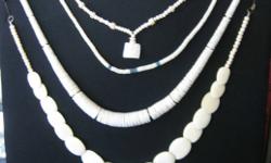 SHELL NECKLACE: 157 carved ridged shell disks, arranged in dramatic, impressive graduated necklace, 20" long - $22
BONE NECKLACES: 17 carved bone pads, largest central pad 2" by 1 1/4", and round carved bone beads,necklace 24" long - $10
Carved flat round