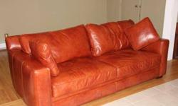Leather couch that seats 3 people and 2 Ottomans, Couch is very comfortable and has a high back, great for Watching T.V.