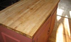 This is a Butcher Block Island with cabinet underneath that is 45 Inches long by 24 Inches wide that has a butcher block on top of a 2 door cabinet on one side with one shelf inside the cabinet for storage. This may be a perfect addition to your own