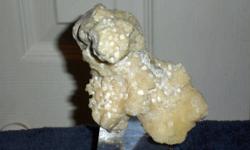 Calcite Crystal and Barite-This is a beautiful specimen in the color of Beige and White. This lovely item that comes from Mexico. This is a very unique and is one of a kind, it show little crevasses and little tiny holes. It?s just breath taking how