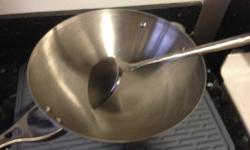 This is a used Calphalon stainless steel wok and matching wok shovel. It's in fine shape. $20.
I'm also selling (see pictures):
A used cat tree, 5' 6" tall, covered with carpeting, and sisal on the uprights. There's an area of leg (the right one in the