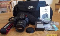 Like new Canon Rebel EQS camera with accessories. Chargeable xtra battery, nice carrying case, wide camera strap. Used very little like new condition - $400 or reasonable offer