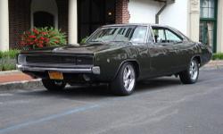 Dodge Charger 1968
Fuel Injected HEMI
1968 Dodge Charger Restored/Modified (Pro touring Style)
Modern performance combined with the best looking muscle car.
Ivy Green/Black Bumble Bee Stripe, Black Interior
Drive anywhere, anytime, no overheating no rough