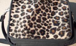 Cheetah Print with Black Trim on one side & Black on the other side
3 Separate Sections:
Main section with inside zipper.
Small section with two pockets. Good for credit cards or transit-fare cards.
Zipper section with 3 cosmetic brushes, which are New &