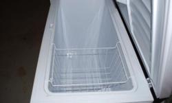 Woods brand chest freezer. Used. White. Approximately 10 Cubic Feet. In good working condition.