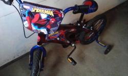 MONGOOSE BOY'S 16" BMX BIKE WITH PEGS, HEAVY FRAME, TRAINING WHEELS, BOTH PEDAL & HANDLE BRAKES. PRACTICALLY NEW - NUBS STILL ON TIRES. EXCELLENT CONDITION. BIKE LOOKS BETTER THAN PICTURED, "SHINY" - LOOKS LIKE NEW. SELLING FOR OVER $114 AT WALMART -
