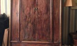 Antique rust/brown colored leather large comfortable chair.
Buyer needs to arrange their own pick up and delivery.
Armoire antique Chinese wedding chest, rustic look with built in shelves. 63H x42Wx22 D buyer needs to arrange their own pick up and