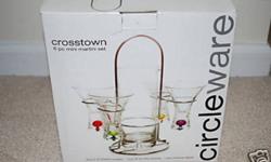 PRODUCT DESCRIPTION AND FEATURES:
This Circleware Crosstown 6PC Mini Martini set is an ultra-modern, super-hip, uber-sleek, extra-cool way to serve up miniature cocktails or massive cordials. Watch your guests jaws drop when you present a micro martini or