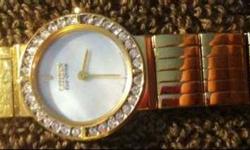 STILL AVAILABLE FOR SALE:
Gold dress watch Citizen Eco Drive, in almost NEW condition, works well.
Polished Gold Stainless Steel Case and Bracelet
32 Sparkling Swarovski Crystals
Stunning Mother of Pearl Dial
Polished Gold Hands, and Markers
Mineral Glass