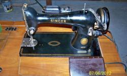 This Antique machine (AL962977) has not been used for some time but was in good working order when stored away. The machine still runs. It comes with the cabinet and accessories shown in the photo. I believe the machine is from the 1950. Also comes with