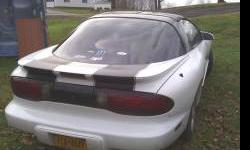 1996 firebird v6 3.8 automatic t tops white black racing stripes power windows locks cd player two sets of wheels no rust runs good has engine lite on goes off at times.nice car would keep need money. Books for over 4100 needs tires. Call or text