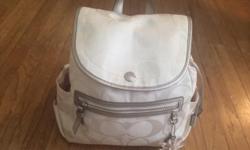 - White Coach Daisy Backpack
- Originally $200
- Perfect condition except for very slight blue tint on bottom of bag (not noticeable when being worn)
- Canvas with patent leather trim
- Front zip pocket, 2 side slip pockets, drawstring, 2 interior slip