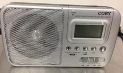 Coby CX39 - it's an AM/FM/Shortwave Digital Portable Radio.
The unit is used. It powers on and works.
Unit has some scratches on front, top, rear, bottom, left and ride side panels.
Includes the AC plug adapter.
The pictures included in the listing are