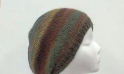 A very unique beanie hat. The colors in this beanie beret hat are several shades of brown, rust, teal, green, dark orange, a large variety of colors. A very comfortable hat that is suitable for men, women and teens. This beanie will fit any head,