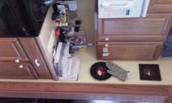 Complete set upper and lower Sunco Light/Medium Oak kitchen cabinets in excellent condition. Less than 5 years old. Consists of 5 upper and 8 lower cabinets. Counter top included. Cost over $4000 new; asking $2000 or reasonable offer. Canton area. Call