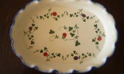 ~~Â Oval BakerÂ ~~
Measures 10 1/4" by 7 1/2" by 1 1/2"
Seymour Mann's Cote Basque, hand painted pattern.
Features multi-colored fruits on green vines with a sponged blue, ruffled edge.
Back-stamped as identified.
CONDITION:
Excellent never unused.Â 
Very