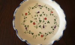 ~~Â Pie PlateÂ ~~
MeasureÂ 9" diameter and 1 1/4" high
Seymour Mann's Cote Basque, hand painted pattern.
Features multi-colored fruits on green vines with a sponged blue, ruffled edge.
Back-stamped as identified.
CONDITION:
Excellent never unused.Â 
Very