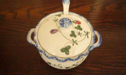 ~~Sugar Bowl with Lid and SpoonÂ ~~
Sugar MeasuresÂ 4" by 3 1/4" high
CREAMER IS SOLD
Seymour Mann's Cote Basque, hand painted pattern.
Features multi-colored fruits on green vines with a sponged blue, ruffled edge.
Back-stamped as identified.
CONDITION:
