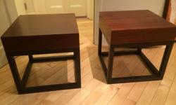 Pair of dark brown-topped Crate & Barrel bunching tables.
Perfect squares (18x18x18), these two tables can be placed together for a coffee table look, or separated to serve as to side or end tables. Great condition, but just don't fit in our new