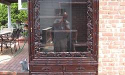 Upper cabinet has 2 glass doors, bottom part of cabinet has 2 black w/push open/closeable doors. May be used for a variety of things. Black wood throughout. 69 1/2 " H x 31W x 14D.