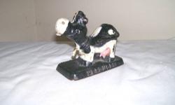 Cast iron cow advertising paperweight. Say's Hercules on one side and Cellulose Gum on other side. Possibly dairy product advertising from Hercules Powder Company. Weights about 2-1/2 pounds. 4" long, 2-1/4" wide, 3-1/4" tall. CALL 845-754-7233 CASH OR