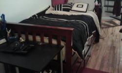 Dark brown twin captain bed with pullout trundle (currently used for storage) and three drawers, bought less then a year ago. I bought a 5 year warranty from the store on it and the mattress, no matter what happens so that comes with it too.
Can buy the
