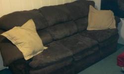 Chocolate colored microfiber couch and reclining chair for sale in great condition. No stains, rips or tears and comes from a very clean and smoke free home. The couch and chair are a matching set and are only a couple years old. Please contact me for