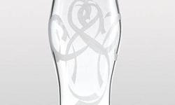 Gorgeous and elegant crystal vase bears an etched motif of flowing ribbons. Look closely and you'll see that the ribbons form free-form hearts. The vase makes a lovely gift for wedding attendants. Genuine Lenox fine crystal. The item is brand new but does