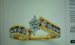 Marquise 1 carat diamond ring center stone is 1/2 carat marquise diamond with 10 round accent diamonds totaling 1/2 carat like new was purchased origionally for 2000.00 14k yellow gold 315-466-6676