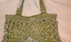 Large gold & bronze drawstring handbag. Two inside pockets and one back zippered pocket.
Width 16"
Height 13.5"
Depth 6"