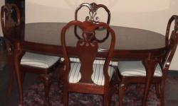 Beautiful Queen Anne ball and claw foot mahogany dining table with 6 chairs
The table is 66 inches long, 44 inches wide and 30 inches high. It comes with two additional leaves that allows it to extend to 98 inches.
The leaves each are 16 inches in width