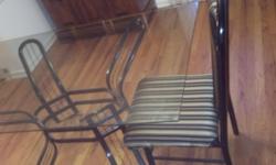 Glass top dining table with light weight metal base. 4 metal chairs with padded seat and back. Repainted and reupholstered about 2 years ago. Good Condition. $75 obo, must go