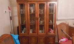 Diningroom set available which includes a China closet, table with leaf and 6 chairs and a server piece. It's in fair condition for $125.00. Also Wood room divider/wall unit/entertainment center-$100.00.Or make me a reasonable offer CONTENTS NOT