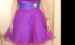 Two tone purple mini, made by Masquerade, size 3/4. Was $220 new, for sale $100. Just above the knees. multi layered tulle in various shades give it a very classy unique look. Very cute dress. this is a small 3/4.