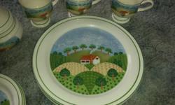 Set of 4 Sangostone 3645 Country Cottage dishes. Good condition $15 for the set.