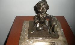 A VERY NICE RARE DISNEY 35 YEAR BRONZE EMPLOYEES CAST
MEMBER SERVICE STATUE OF PINOCCHIO
