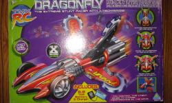 This is a lightly used and working Dragonfly RC Car in its original box. with battery and charger and remote control.as-is. This does 360 degree spins, flips and turns is it's claim to fame.
The 9.6 Volt replaceable TMX battery pack takes a charge and you