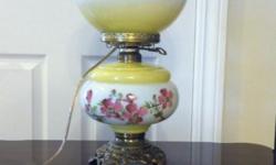 Hand painted, elaborate brass base. Works and is in excellent condition. Both globes light up. Seperately and together