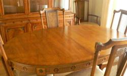 Empire Style, walnut color, 60" oval dining room table.
Comes with 15" wide leaf extension, and original table pad.
Table in excellent condition.
Comes with 6 chairs, 4 armless and 2 with arms.
Brass applique detailing on the table.
Chairs are in good