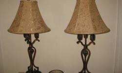 These lamps have classic European iron work with a bronze finish. The hexagon bell shade is a tan colored textile. They stand 33" tall. Cash or PayPal accepted. Delivery available in NYC Metro area.