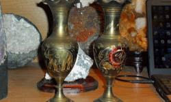 Elephant and Floral Brass Vases Set-This is a Antique Brass Vases from India with Elephant and Floral Design. One side has a picture of a Elephant and the other side has a Floral design. Measurements: 9 Â¾? Tall, Base 2 Â¾?, Middle around 3? and Across Top