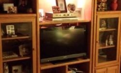 Two piece wood entertainment center from Raymour & Flannigan. Lots of storage space and Unit is in very good clean condition.
Measures 70 in. height 83 in. wide 17 in. deep. Inside area for TV measures 34 1/2 inches across. TV in picture is a 36' flat