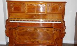 This French Erard Art Case upright piano has a truly remarkable case. The veneer inlay and the legs are hand carved. It?s a true work of artistry and craftsmanship. This piano has been fully restored with new tuning pins and strings. The original