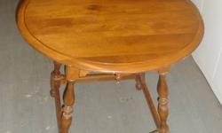 Solid wood round-top table from Ethan Allen. The beautiful structure is very strong, made to last. It's in excellent condition and structurally sound, with some slight scratches. I bought it new for hundreds of dollars, and any reasonable offer will be