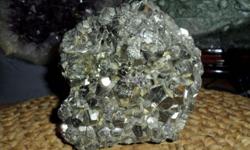 Large Pyrite Cubic Crystals-This a Exceptional Beautiful Specimen of Cubic Pyrite from the country Peru . Pyrite is in the family of gold and copper ore. Pyrite is known as fools gold. Color gold rust. The would make a great specimen to add to your