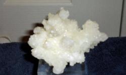 Crystal Calcite Cluster- This is a beautiful rare specimen of calcite crystal cluster. Shows many different crystals of Pure White clusters that comes from ? Champagne/France. This would make a great specimen to add to your collection. Size 2? Tall 4?