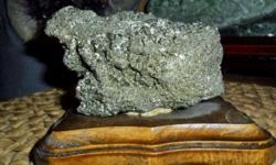 Exceptional Pyrite Crystal on a Wooden Base-This is a perfect one of a kind gift. Pyrite Crystals embedded and encrusting, cube,with many characteristics and combinations of granular and cubic crystals. Pyrite occurs in deposits on its own in,