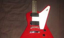 i have a sweet slammer by hamer model XP-1 standard "explorer style" electric guitar. features red gloss finish, 22 fret bolt on maple neck with rosewood fretboard, 3 position pickup selector switch, volume and tone knobs, stock humbucker pickups and
